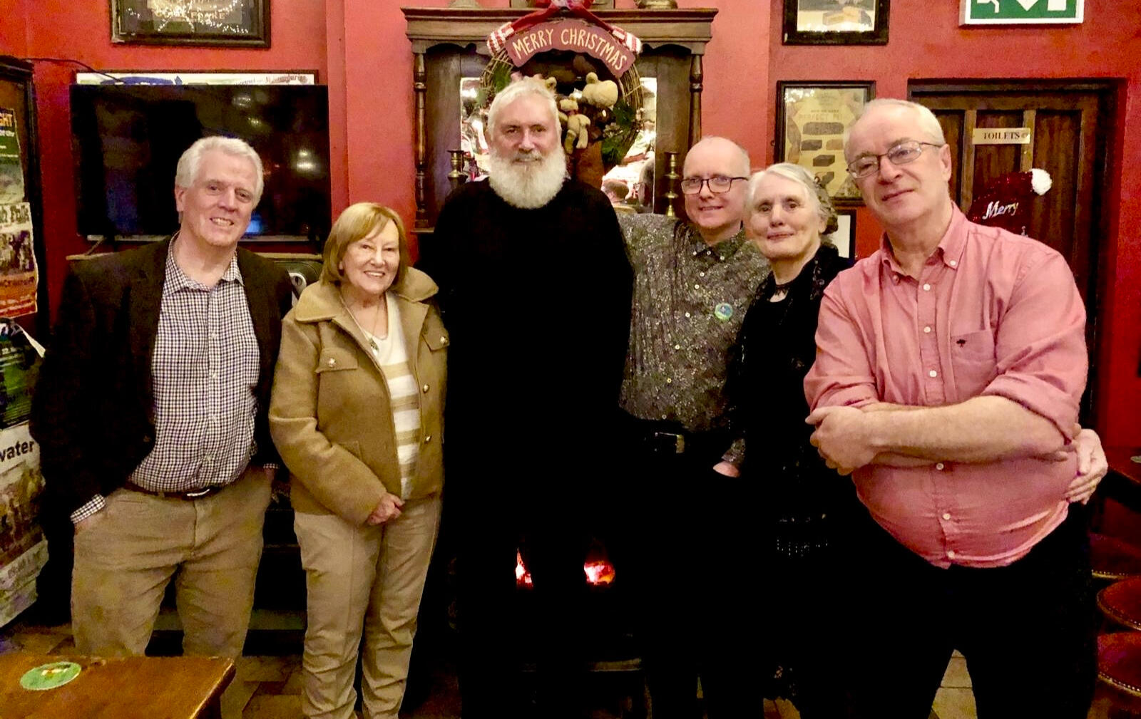 Winners and officials from the 2025 waterford poetry competion - Bob McLoughlin, Kathleen Fahey, Kevin MacAlan, Alan Murphy, Hilary Healy, and Colm Barry.